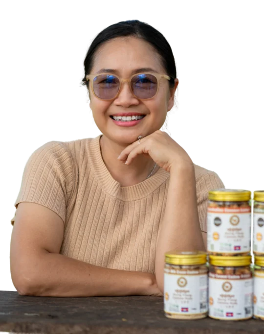 Chakrya MUTH, Founder and Chairwoman of HCST, with jars of HCST flavoured cashews